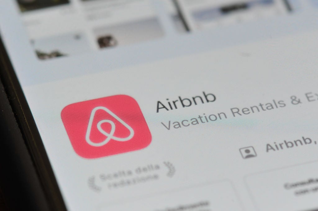 Airbnb app logo on smartphone screen