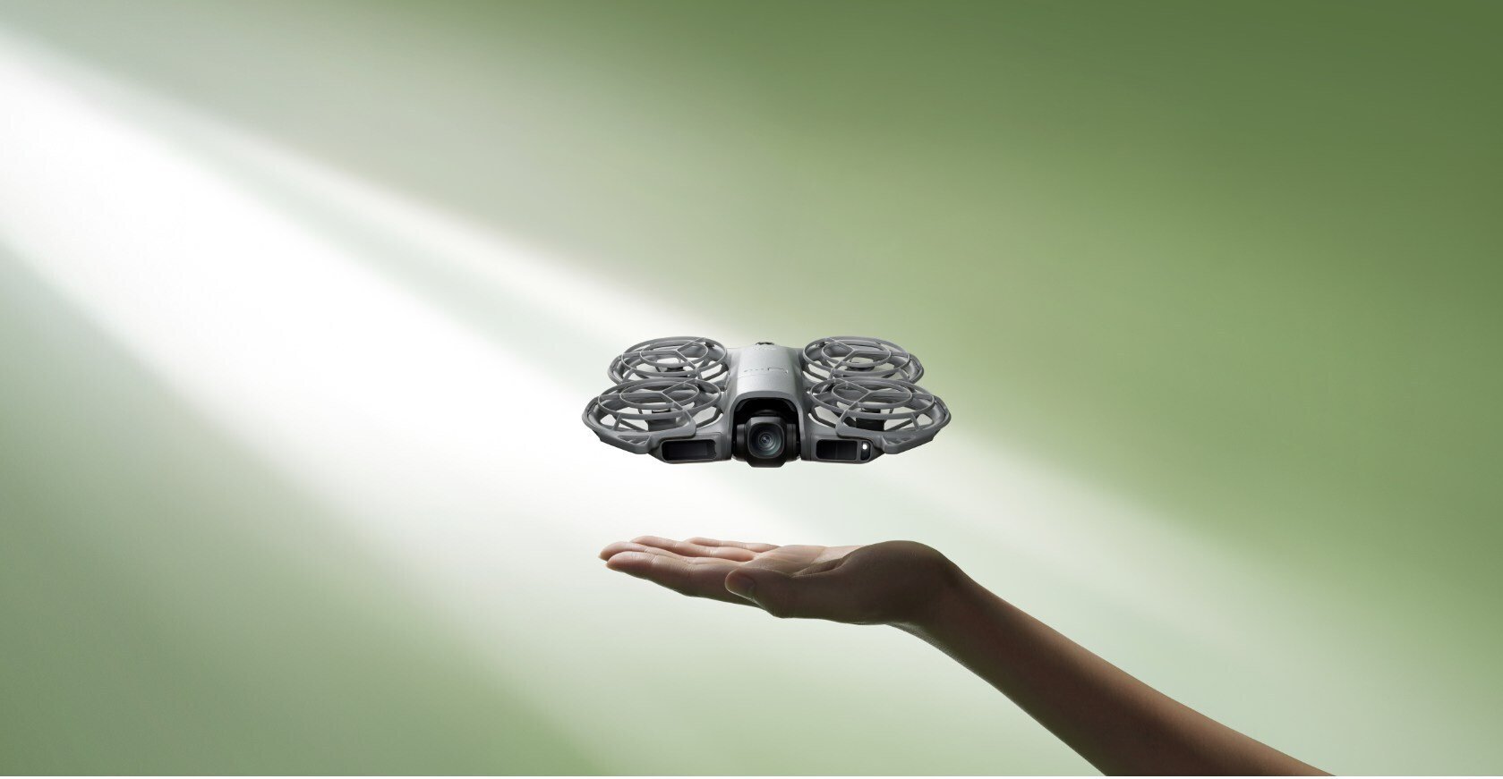 hand held out under dji neo 2 drone