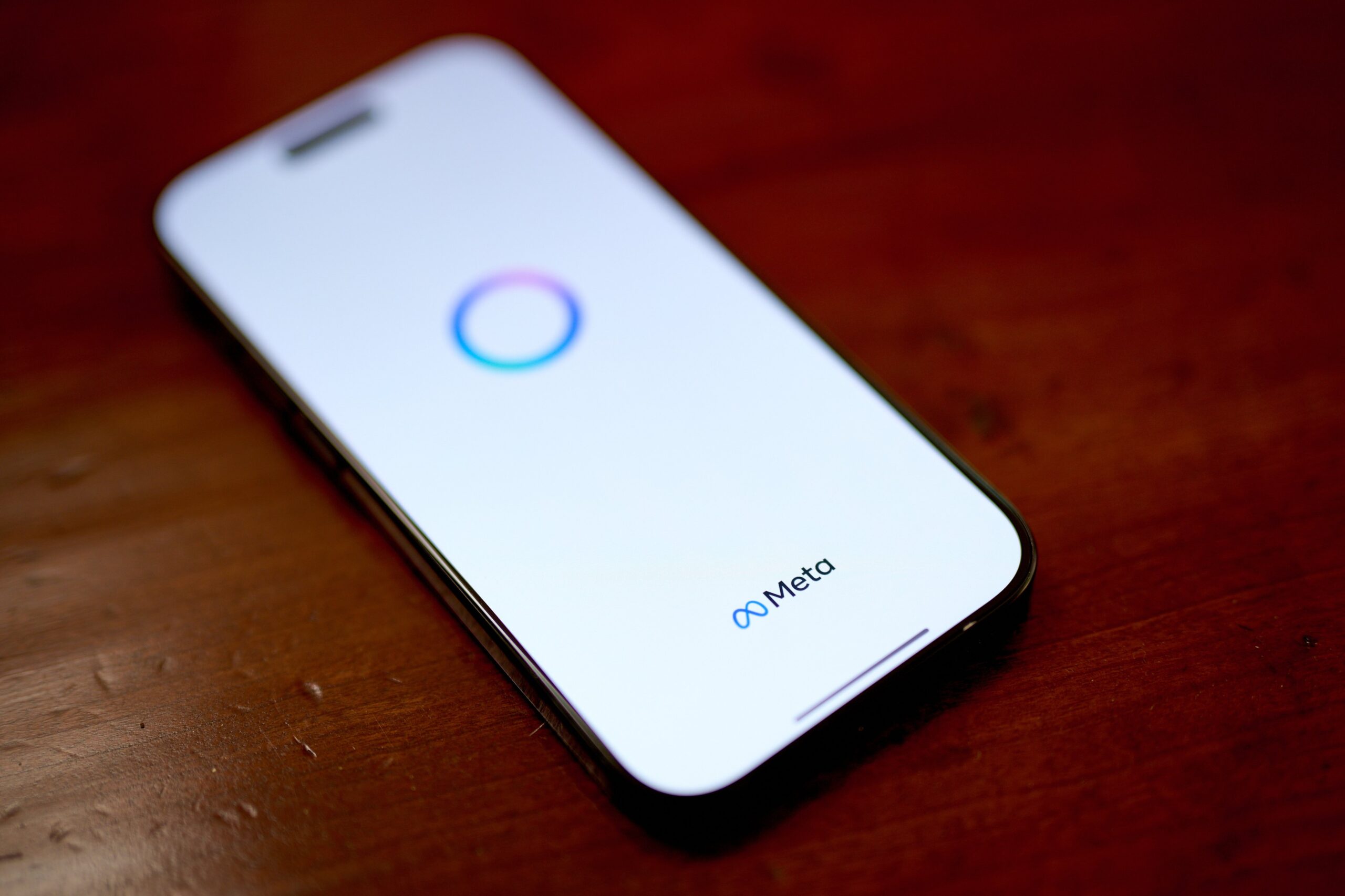 meta logo on a phone