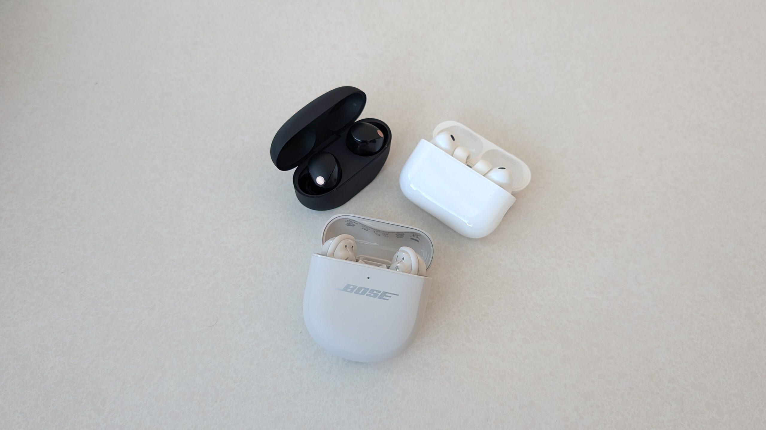Bose QC Ultra Earbuds (Gen 2), AirPods Pro 3 and Sony WF-1000xM5 earbuds.