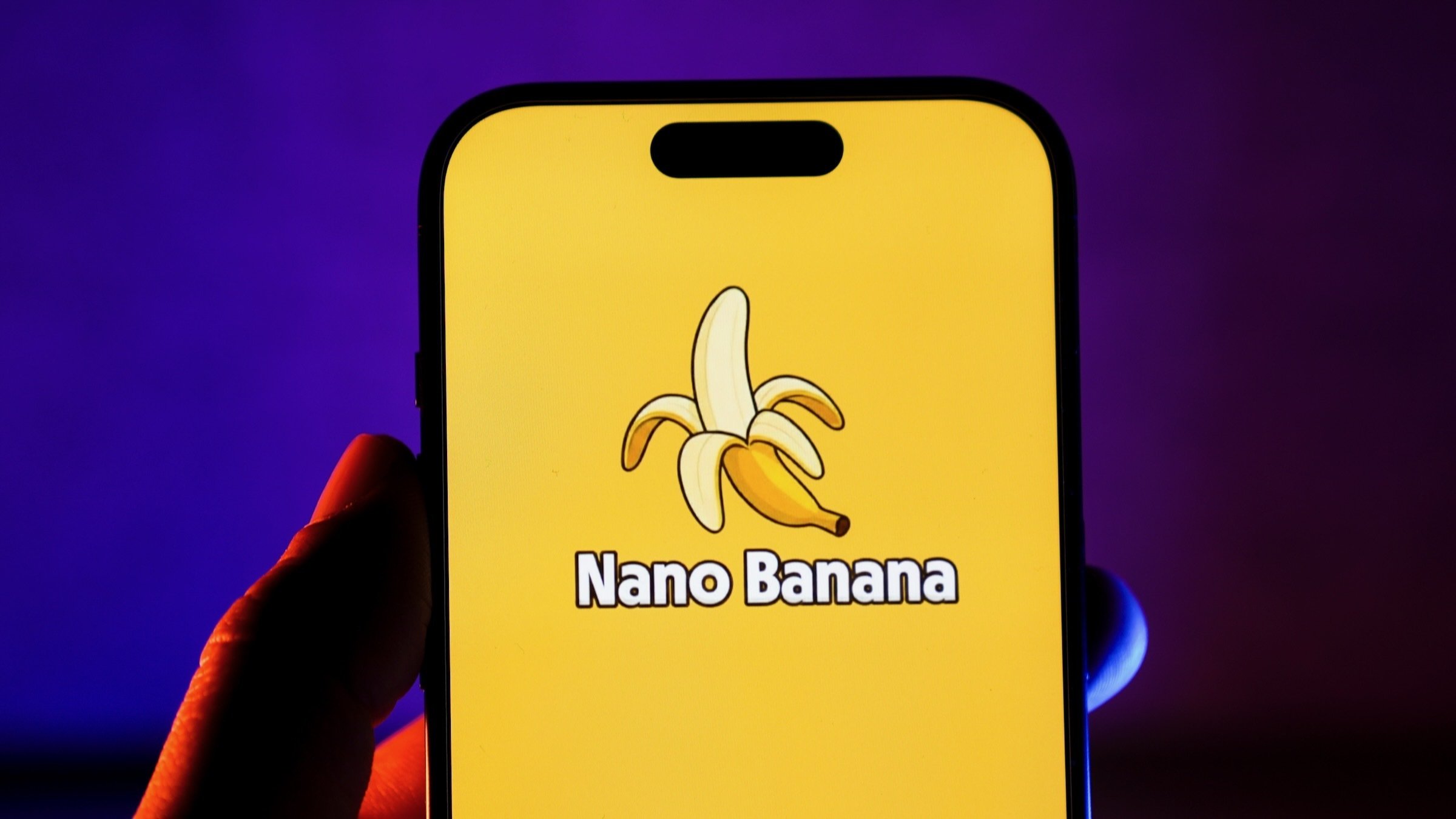 The Nano Banana logo is displayed on a yellow phone screen in this photo illustration.