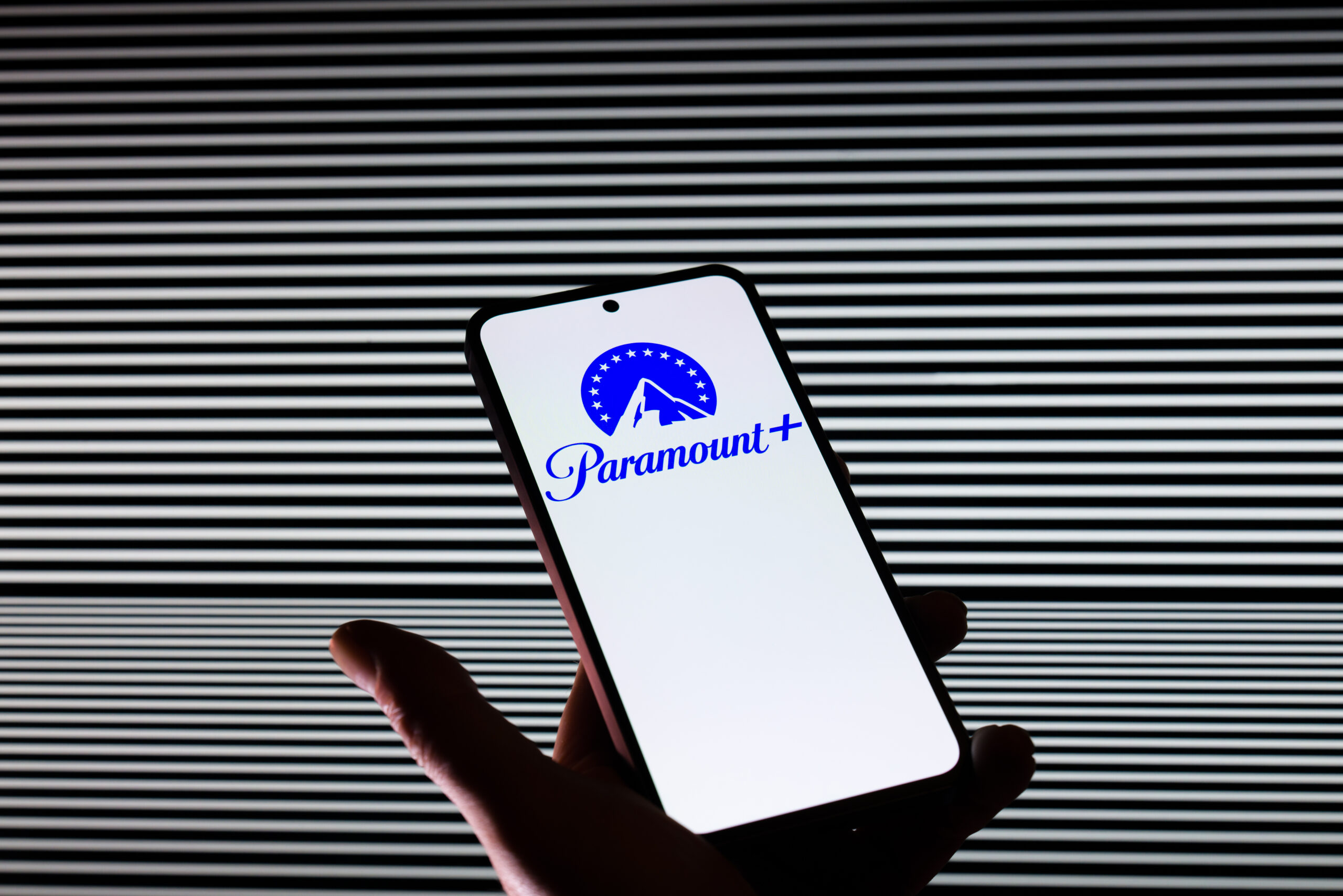 The Paramount logo is displayed on a mobile phone