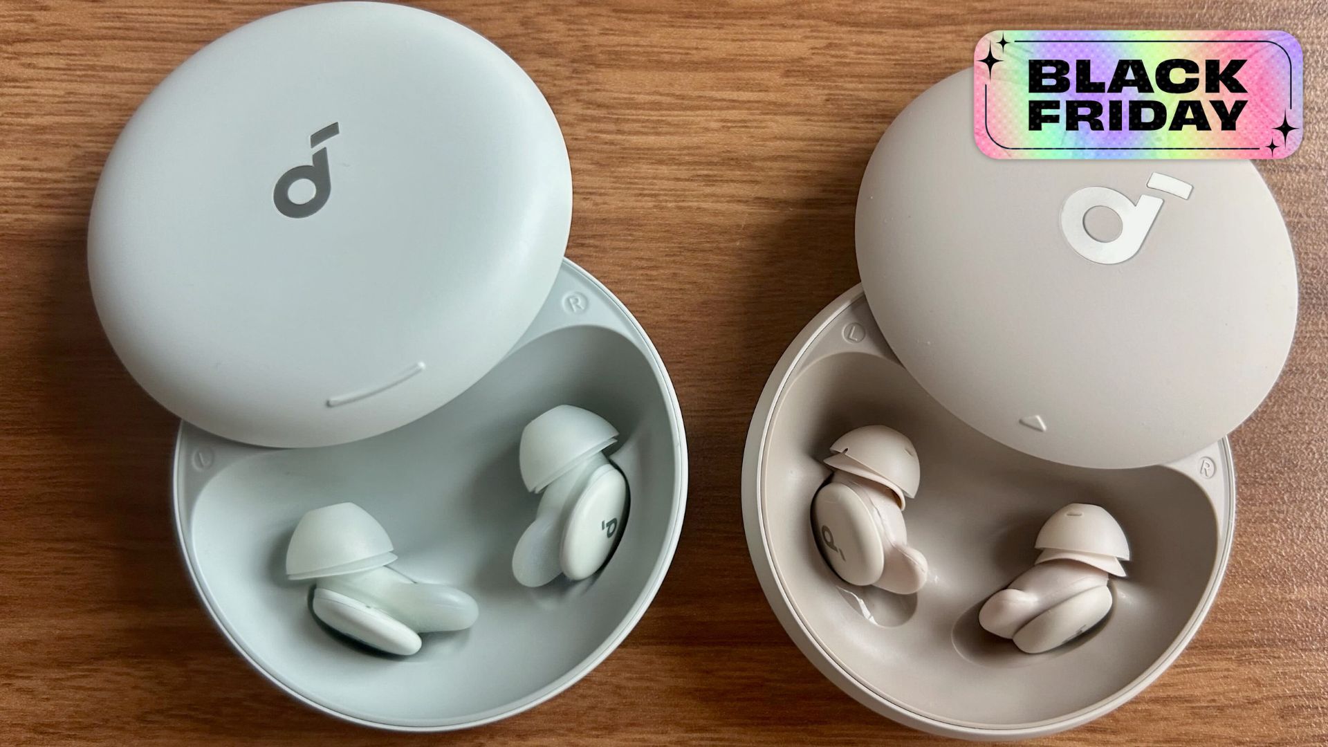 the blue anker soundcore sleep a30 earbuds in case next to tan sleep 20 earbuds in case on tabletop 
