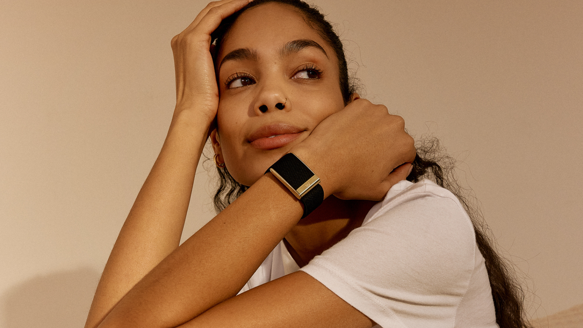 A person wearing a Whoop MG wearable