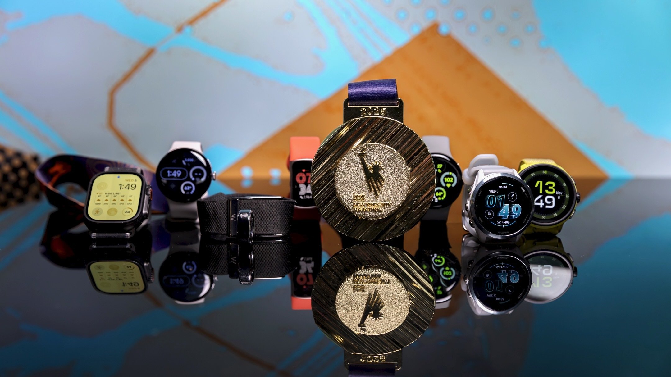 seven fitness trackers with a new york city marathon medal