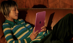 woman using ipad on couch