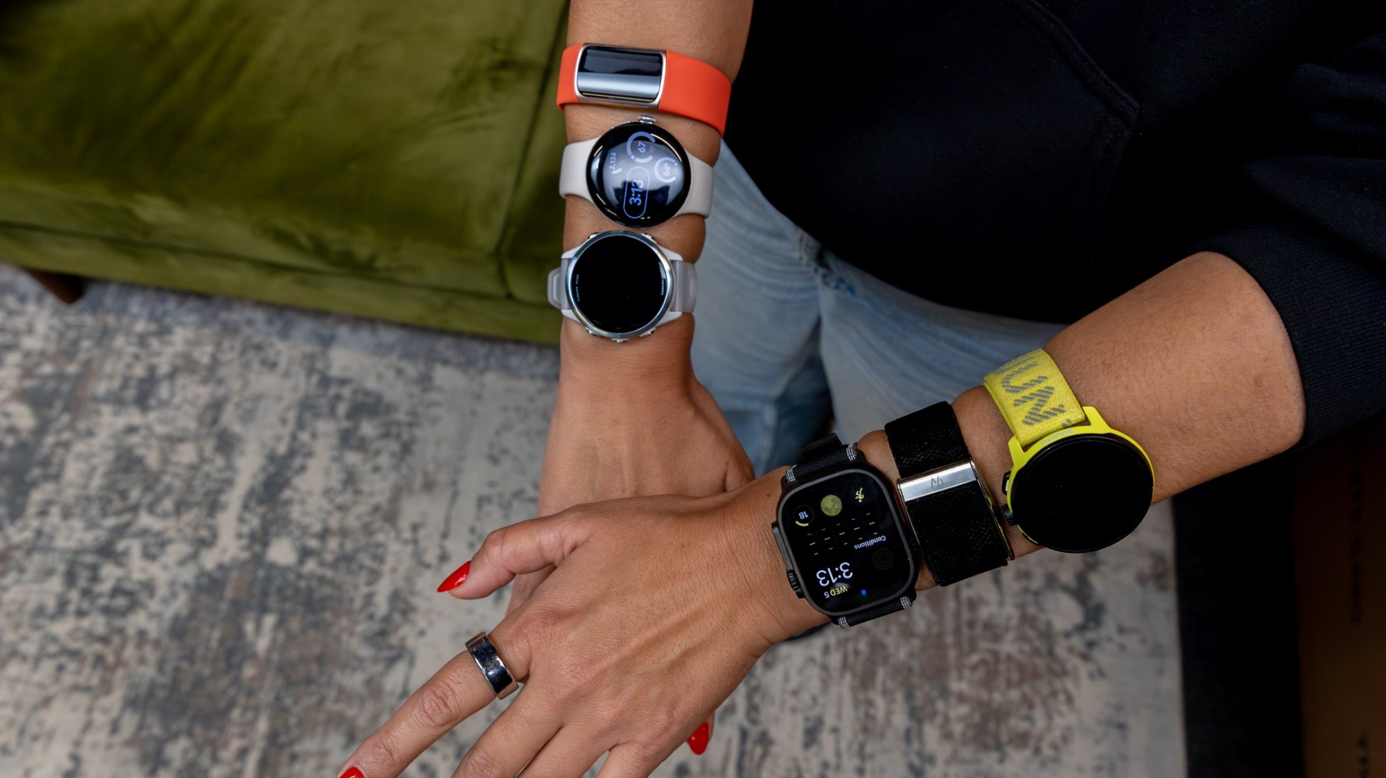 reporter cj silva wearing seven fitness trackers at once