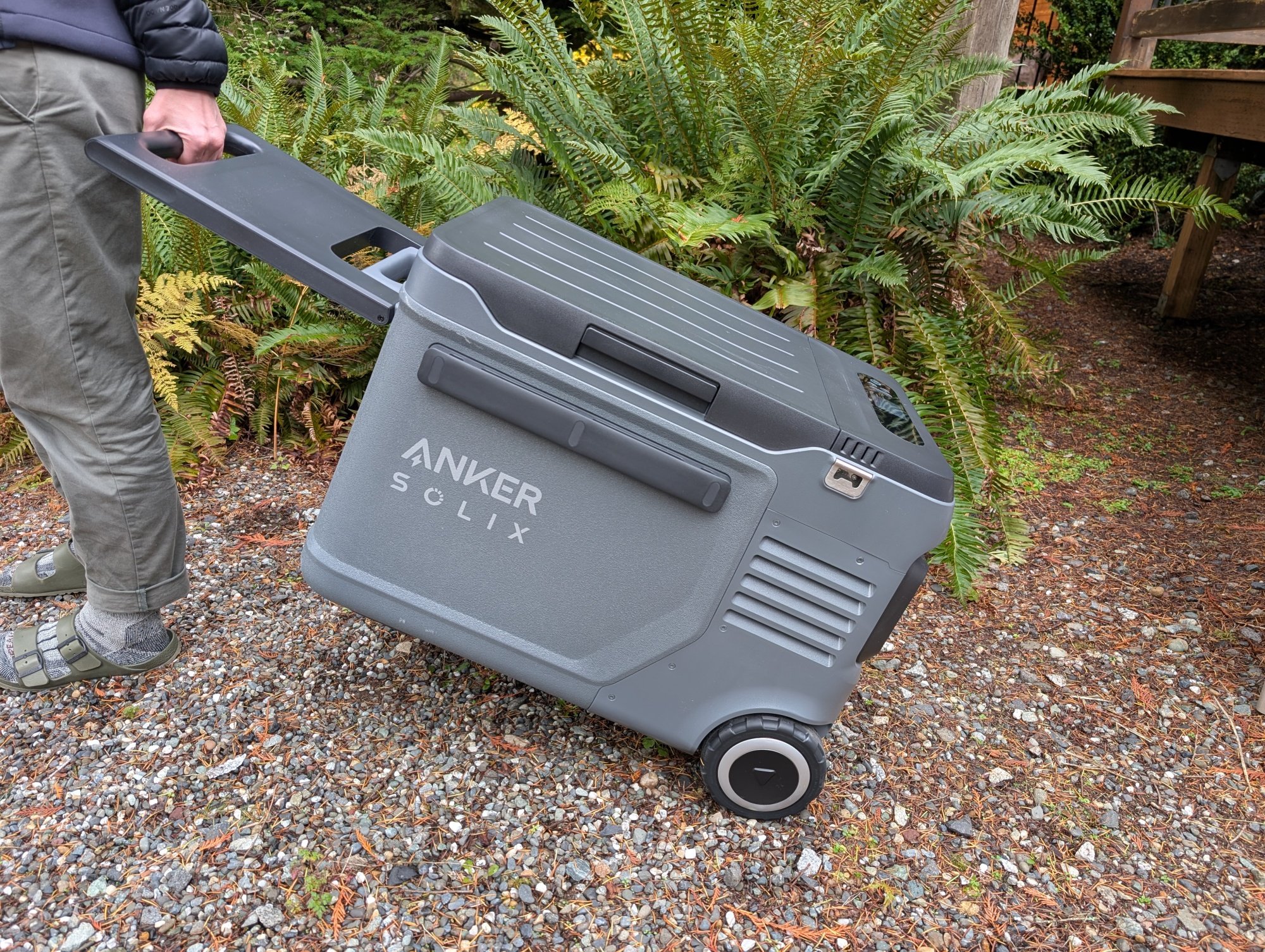 the anker solix everfrost 2 electric cooler being wheeled around outside