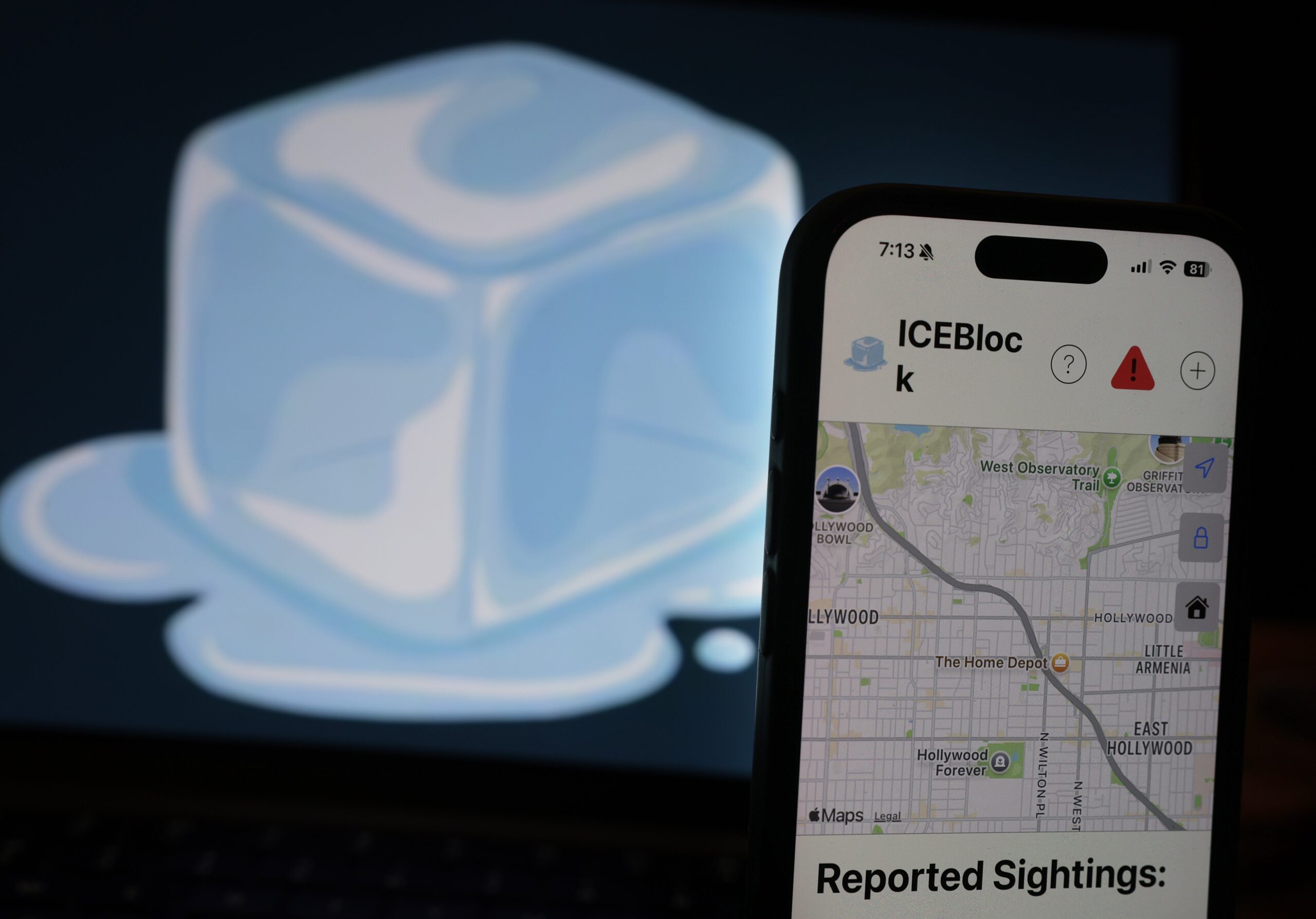 A large illustration of an ice cube behind an iPhone displaying the ICEBlock app.