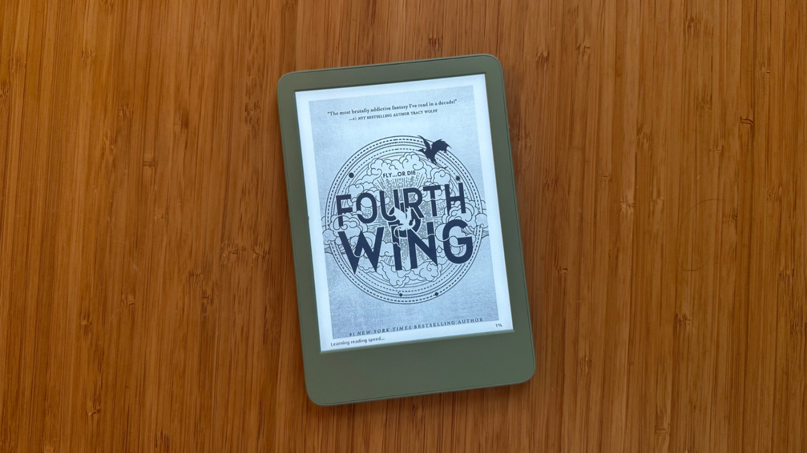 Amazon Kindle device on wooden desktop