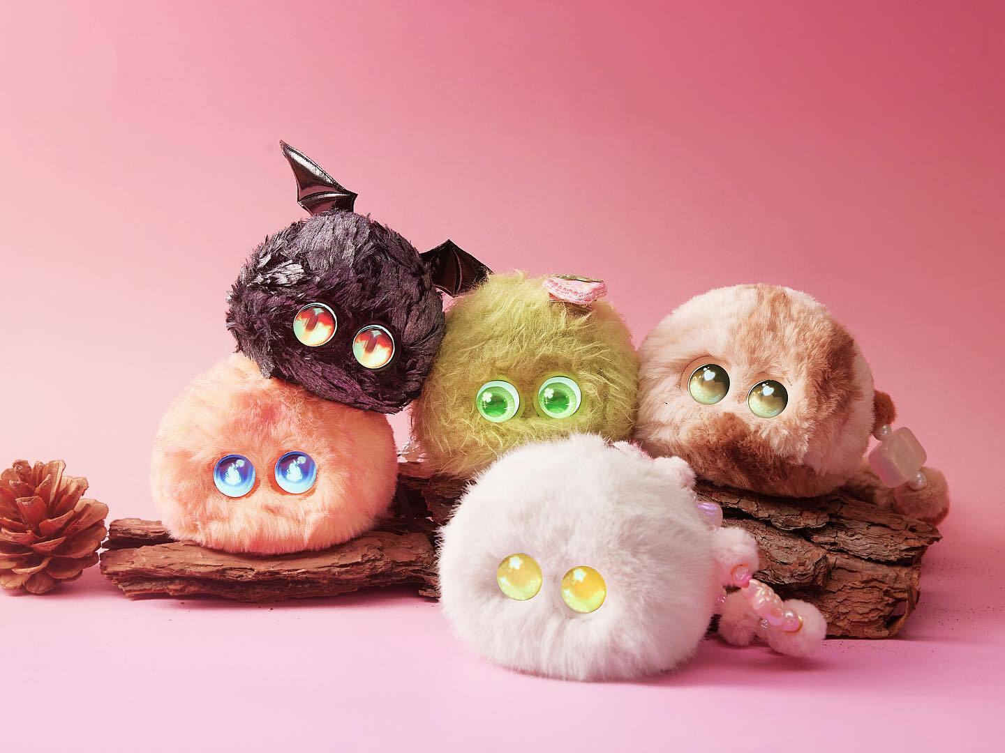 collection of fuzozo ai companion toys in a pile