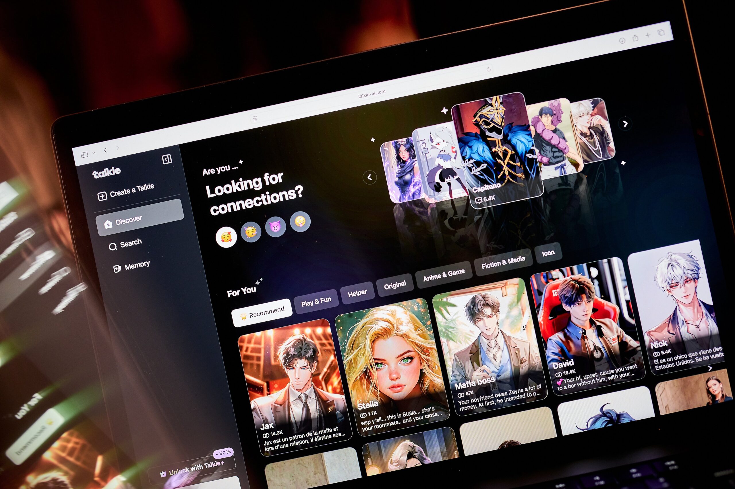 A laptop screen displays the homepage for the AI companion company Talkie AI.