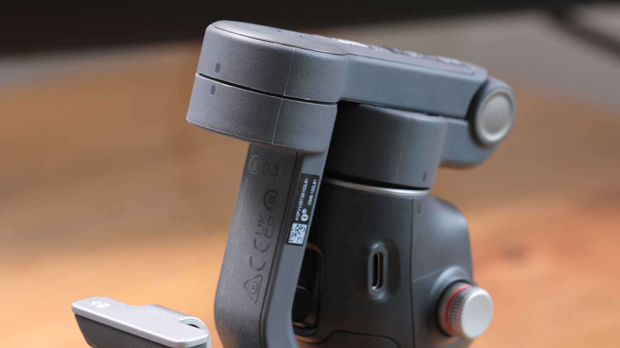 The DJI Osmo Mobile 8 folded up.