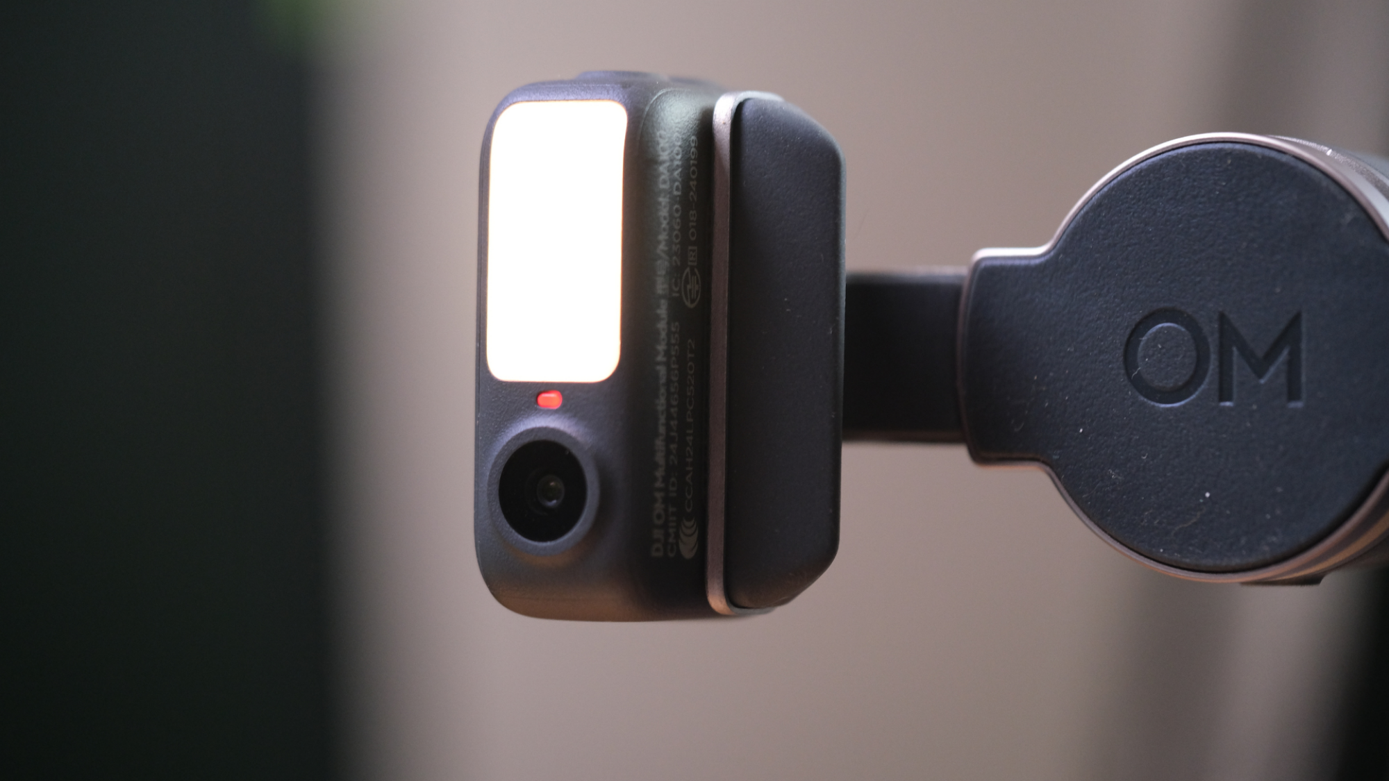 A close up on the DJI Osmo Mobile 8's multifunctional module.