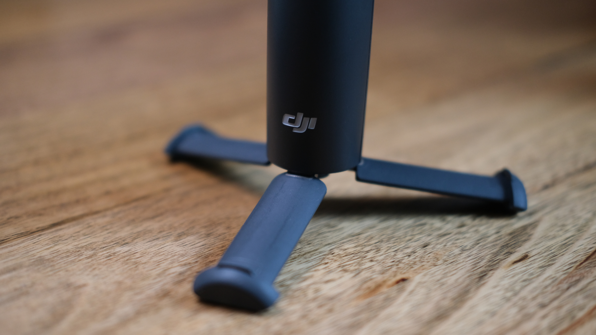 The DJI Osmo Mobile 8's tripod stand deployed.