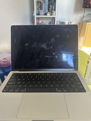 A MacBook Pro with a dirty screen