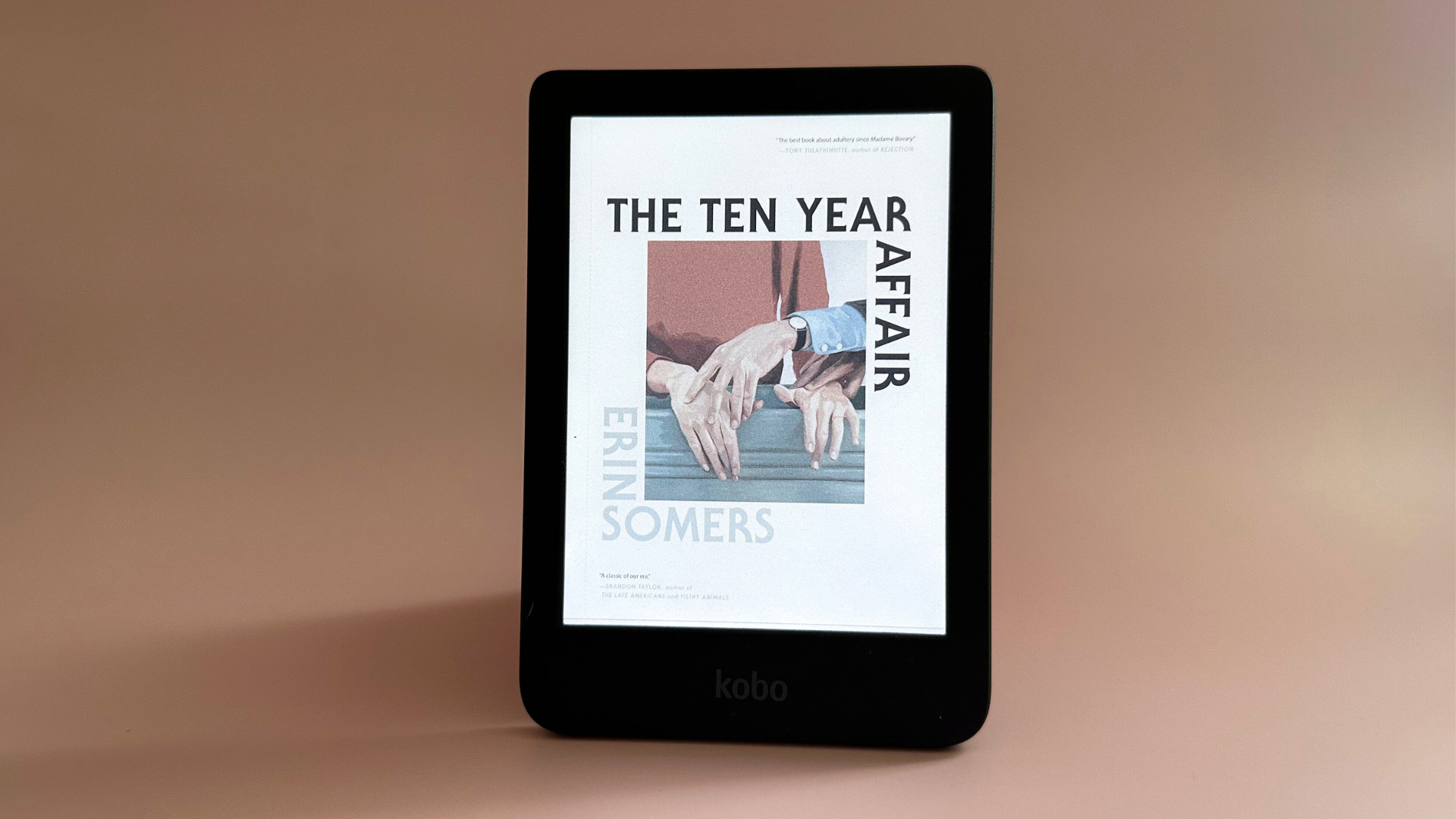 A Kobo Clara Colour on a pale pink background