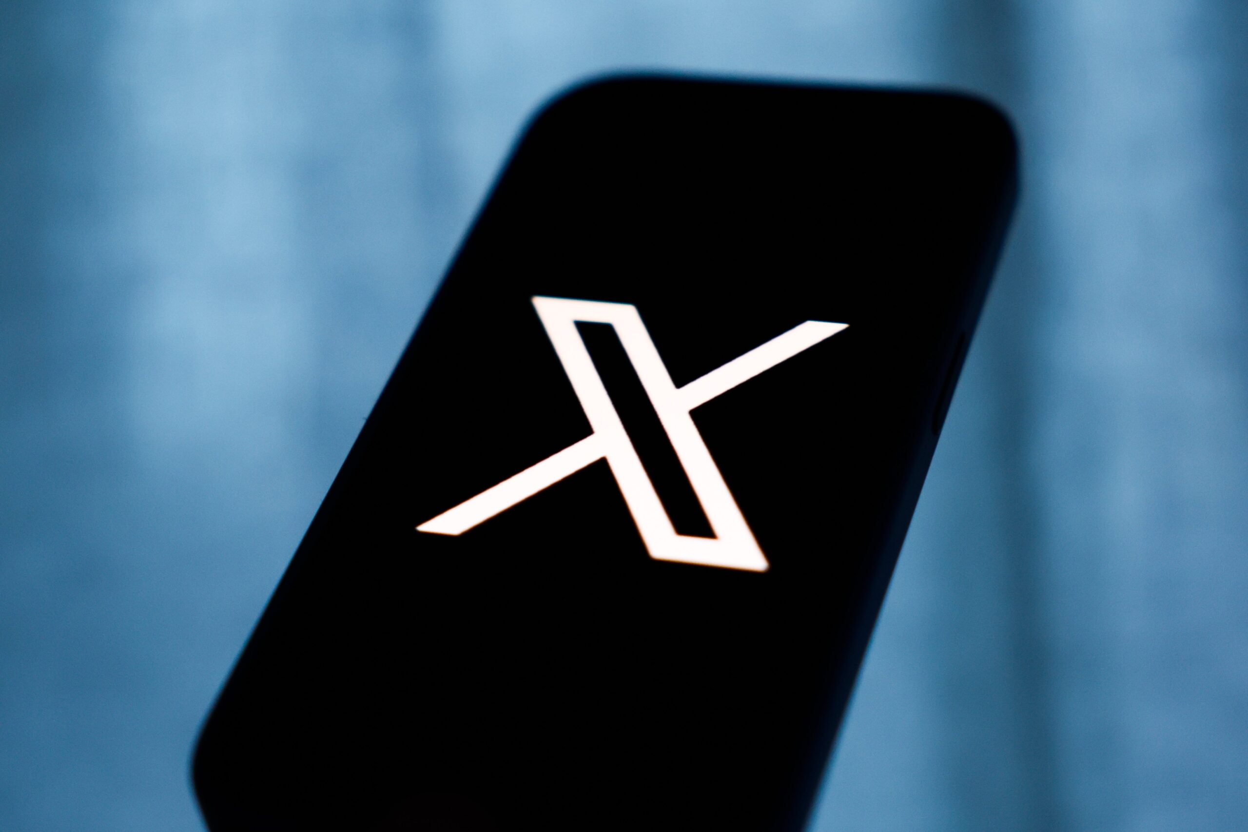 X logo on mobile device