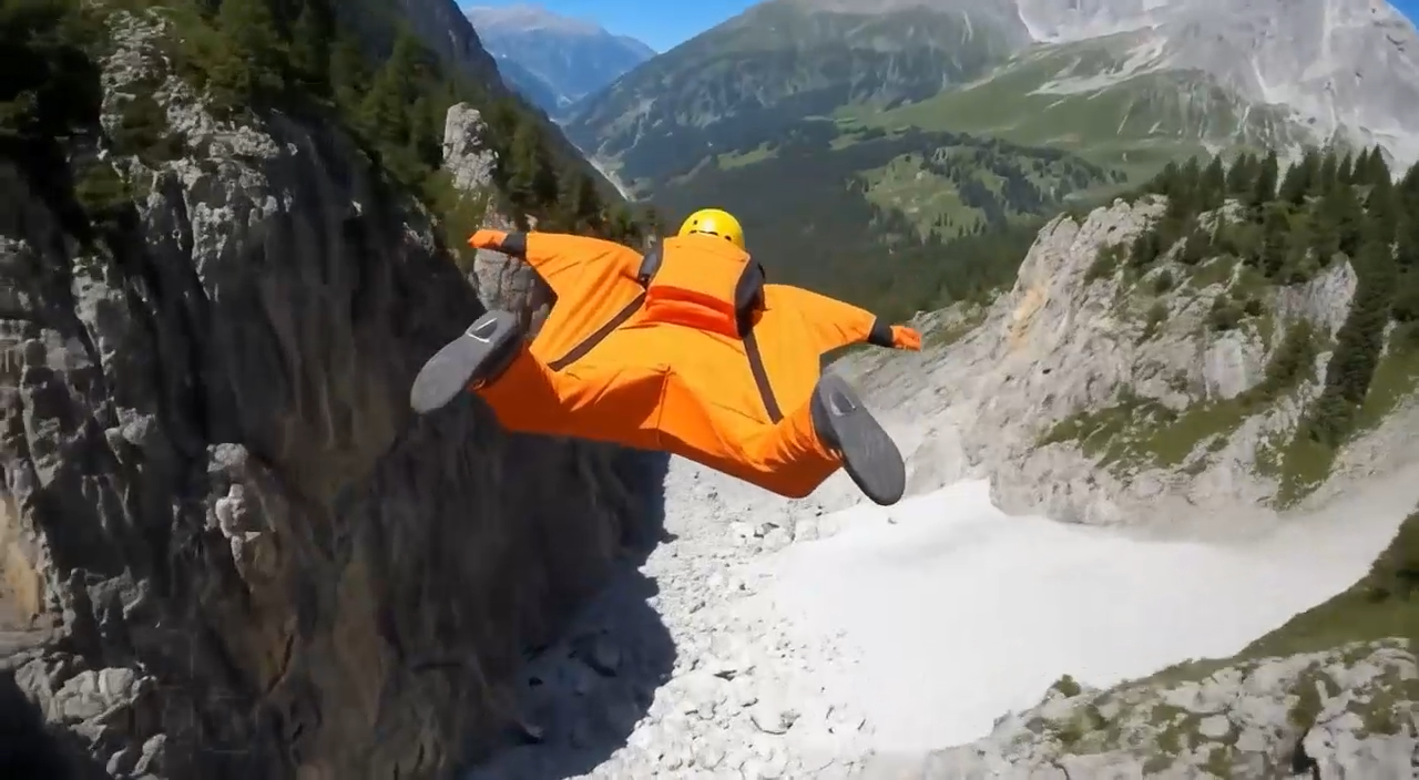 a wingsuit flyer appears in a virtual world created by google project Genie