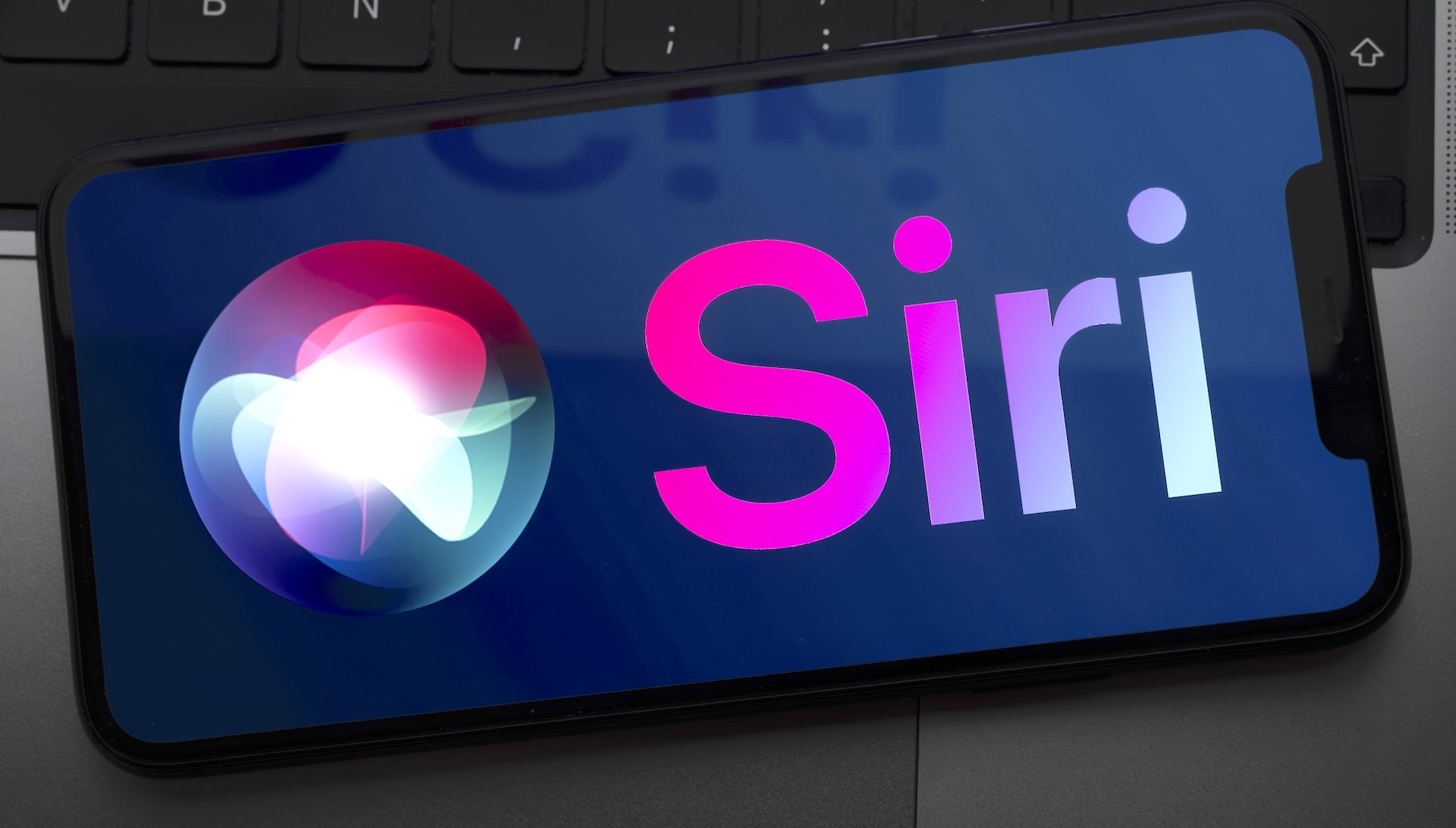 A Siri logo on a smartphone screen