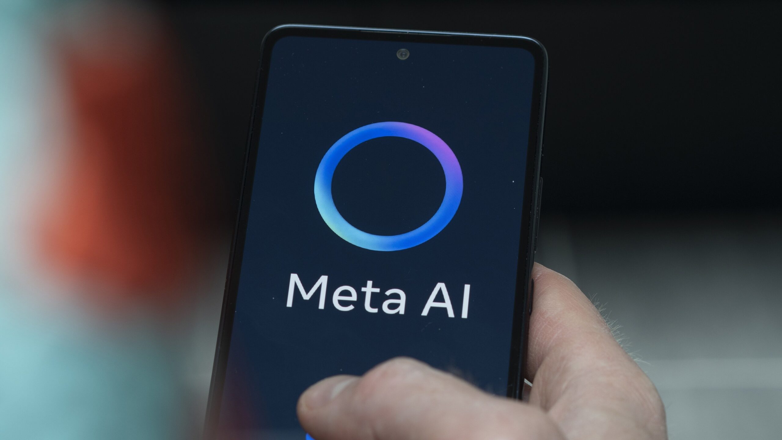 A Meta AI logo on a smartphone.