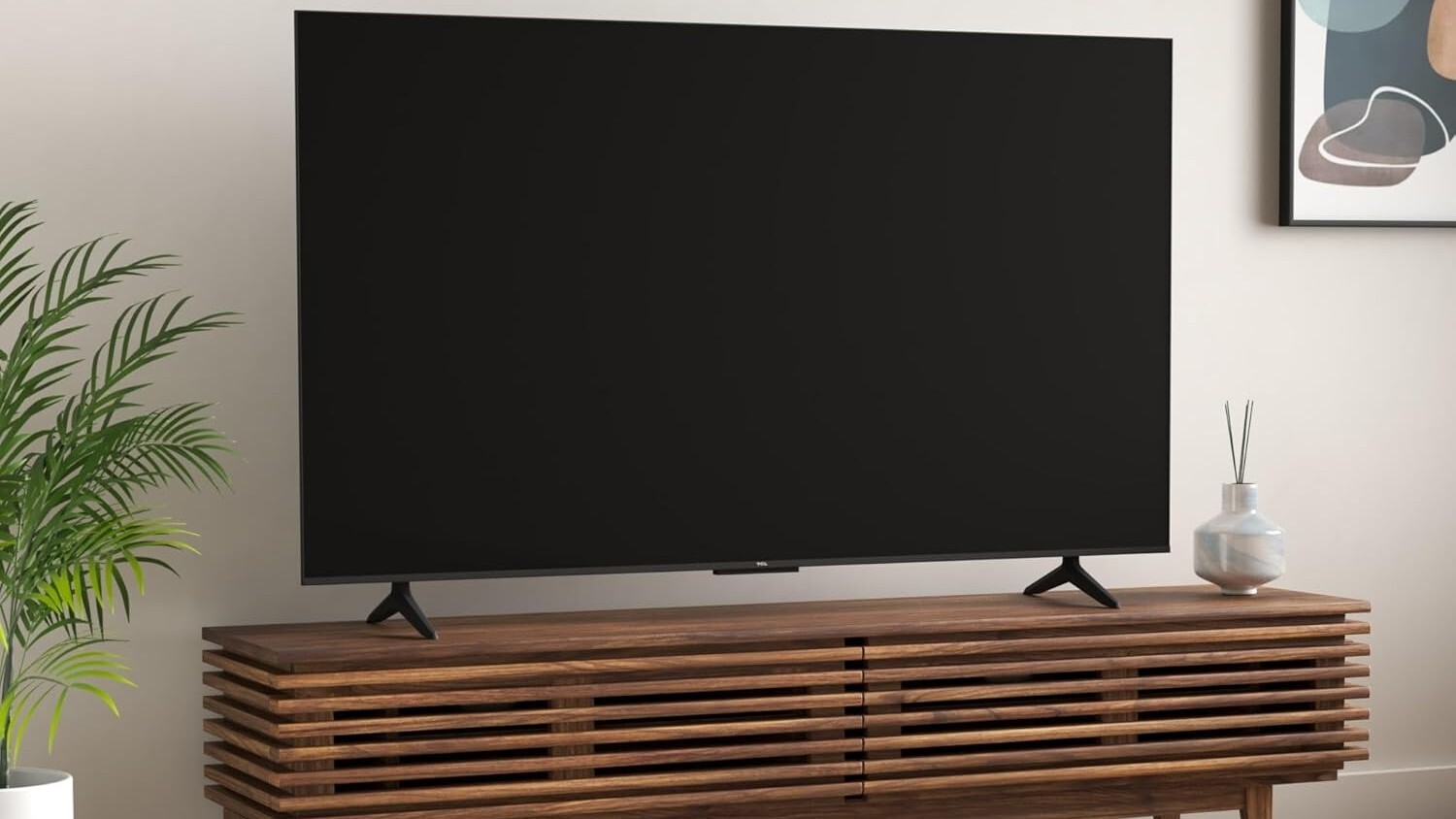 the 65-inch TCL Class S5 4K TV in a living room sitting on a wooden entertainment center