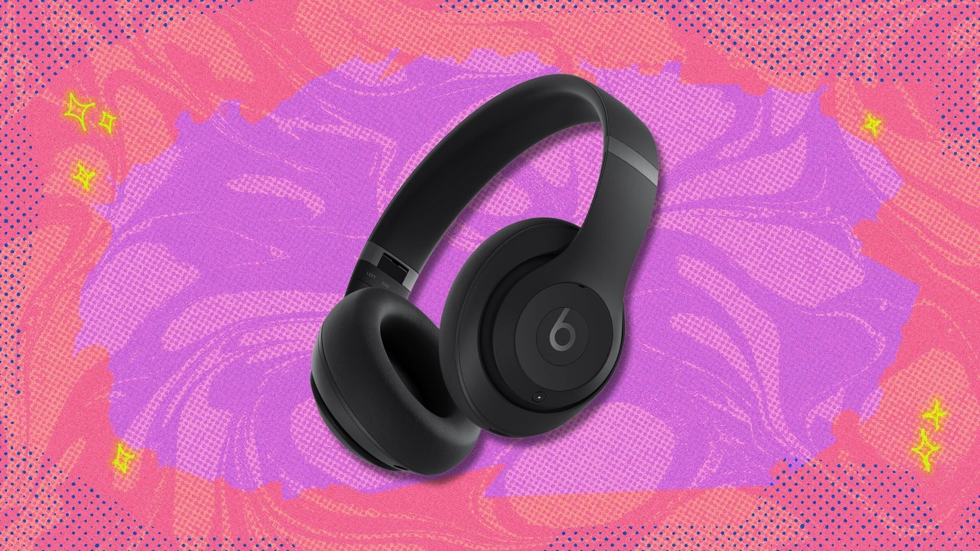 beats studio pro headphones against a pink and purple patterned background