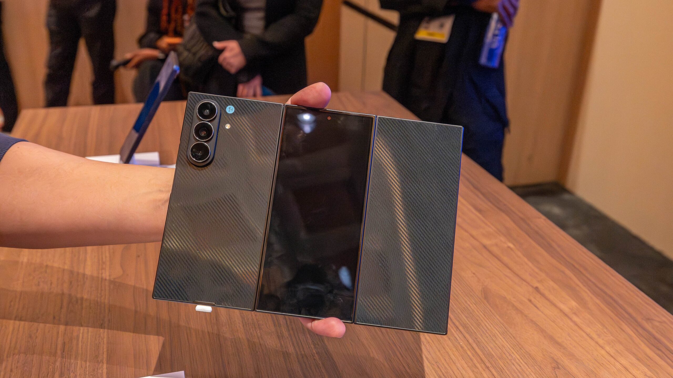 White man holds samsung galaxy z trifold