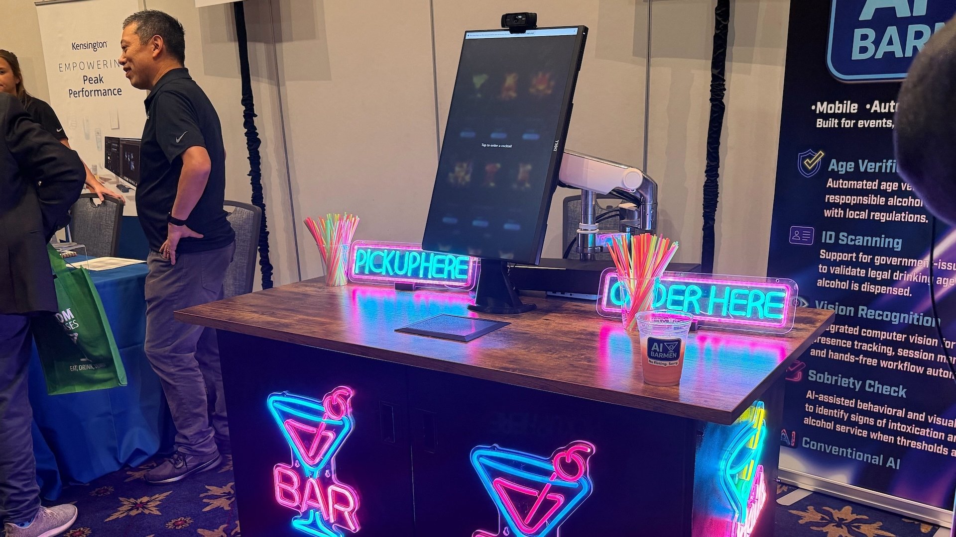 Neon covered table for an AI bartender at CES 2026.