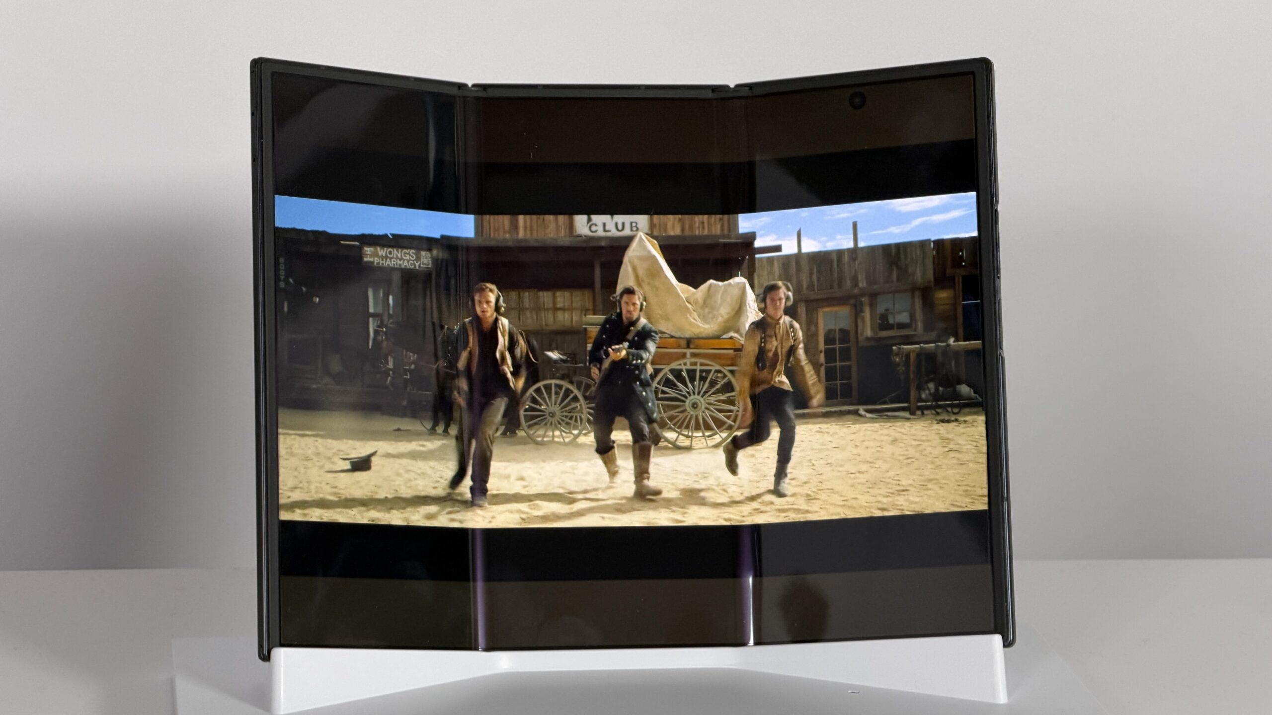 A trifold phone, displaying a movie on screen.