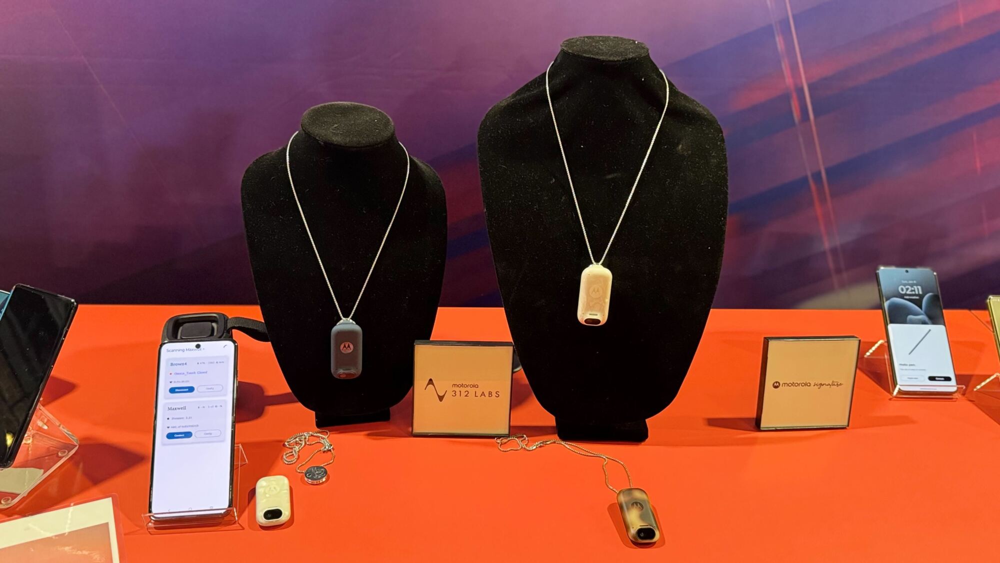 wearable AI devices on black busts