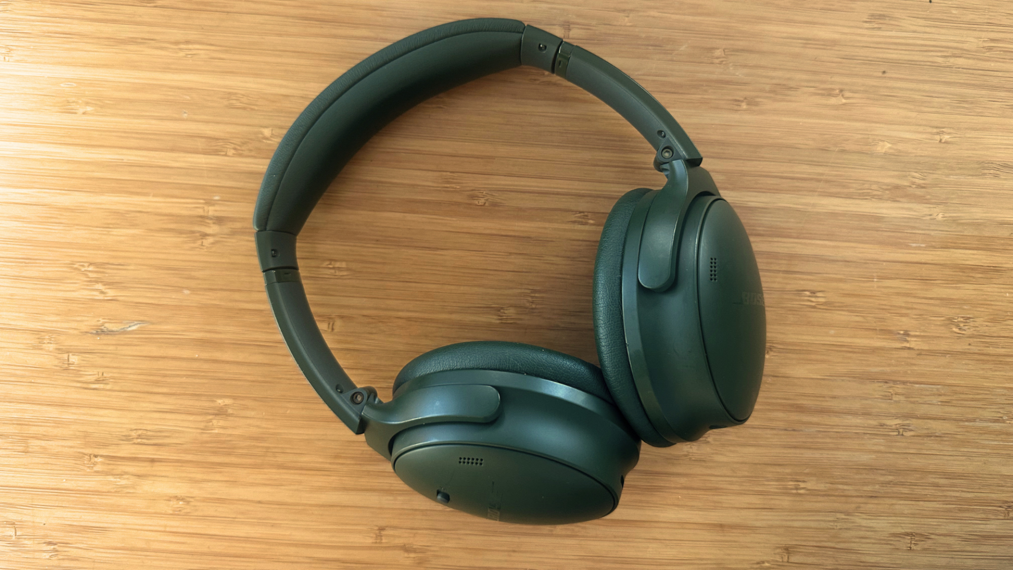A pair of Bose QuietComfort headphones on a table