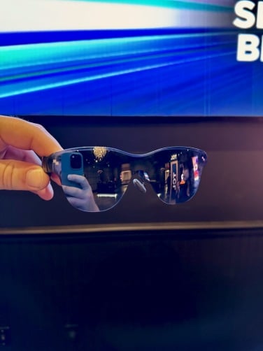 TCL RayNeo Air 4 Pro glasses held in hand