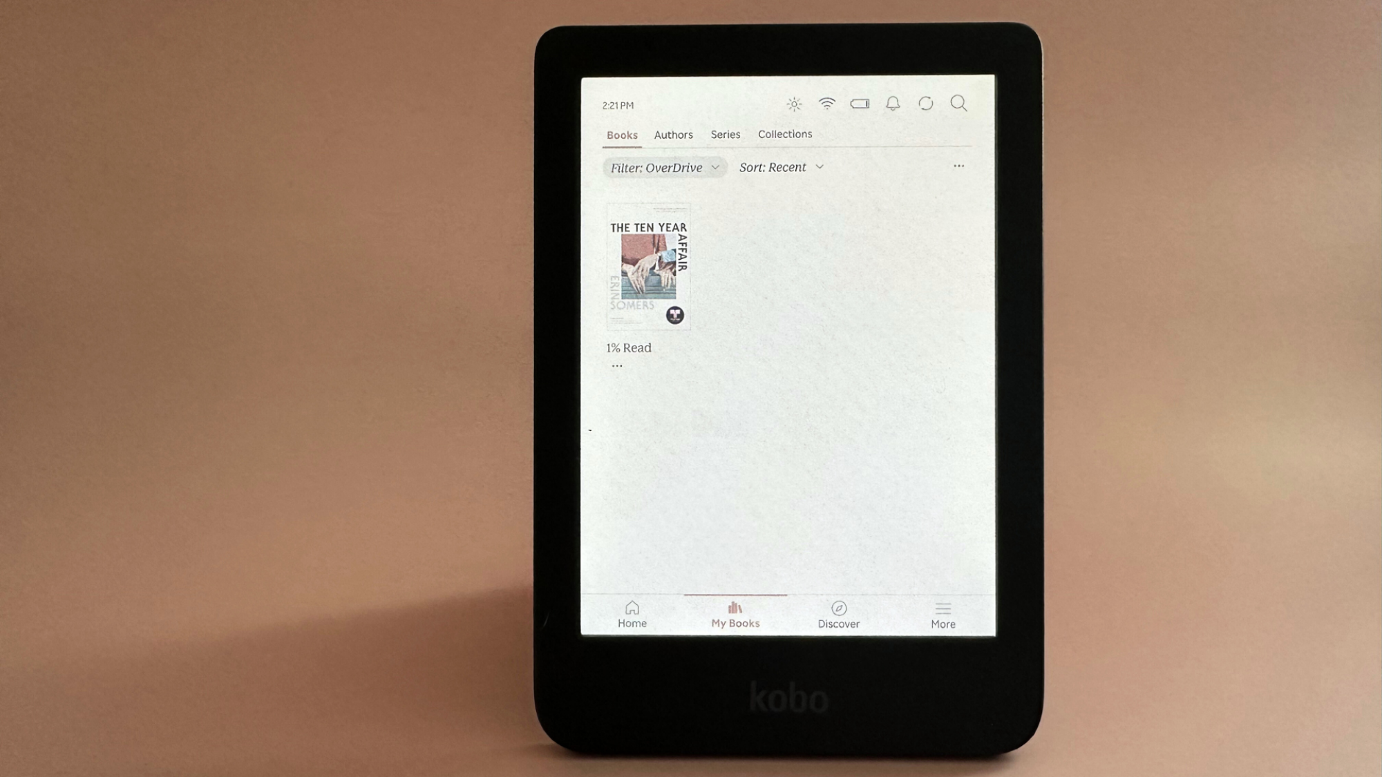 A Kobo Clara Colour on a pale pink background