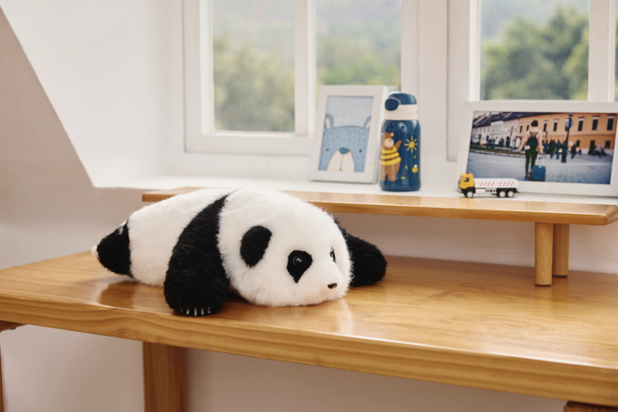 an ai panda on a window sill