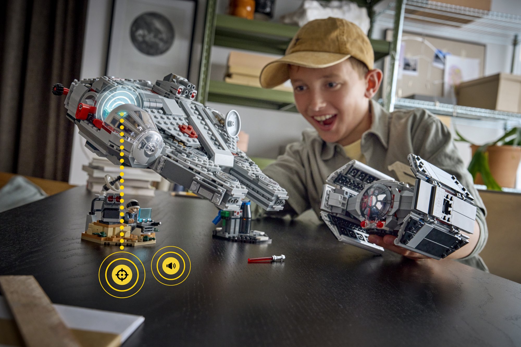 a boy playing with lego star wars smart play sets