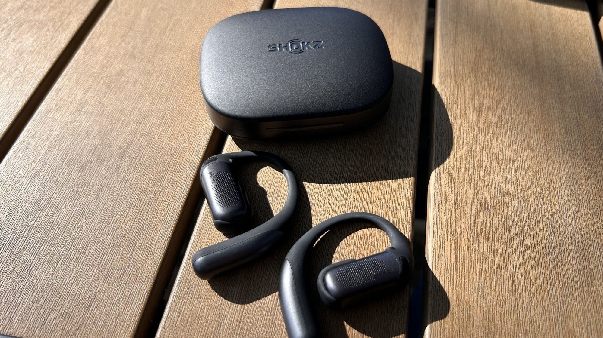 shokz openfit pro earbuds on tabletop