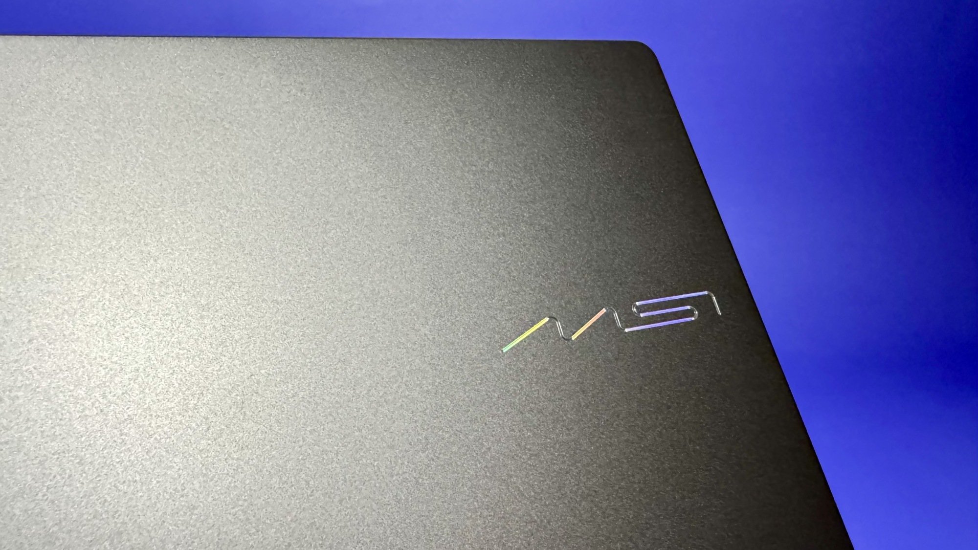 the msi logo on the lid of the msi prestige 14 flip ai+