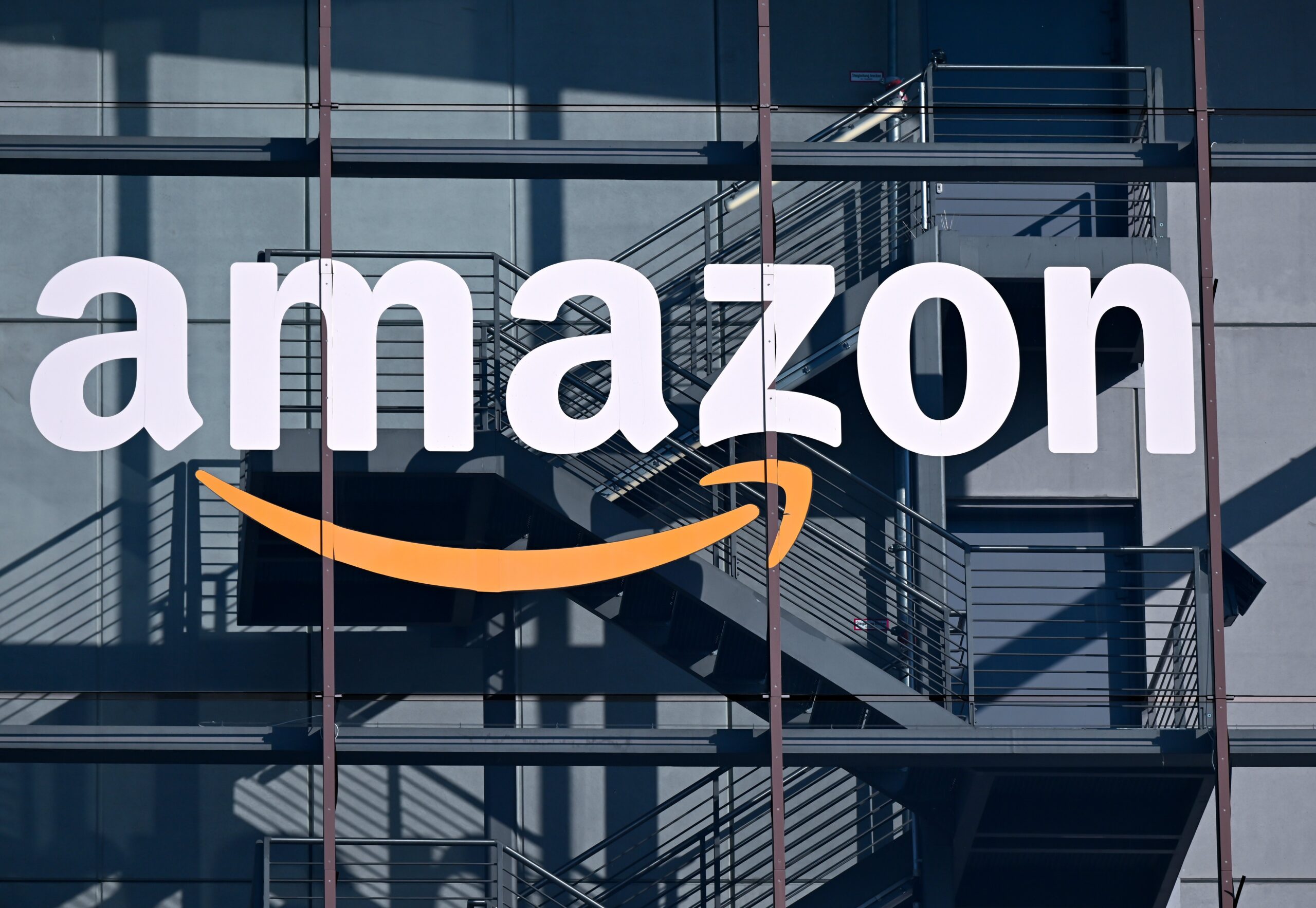 The logo and lettering of online retailer Amazon can be seen on the façade of Amazon Germany's headquarters