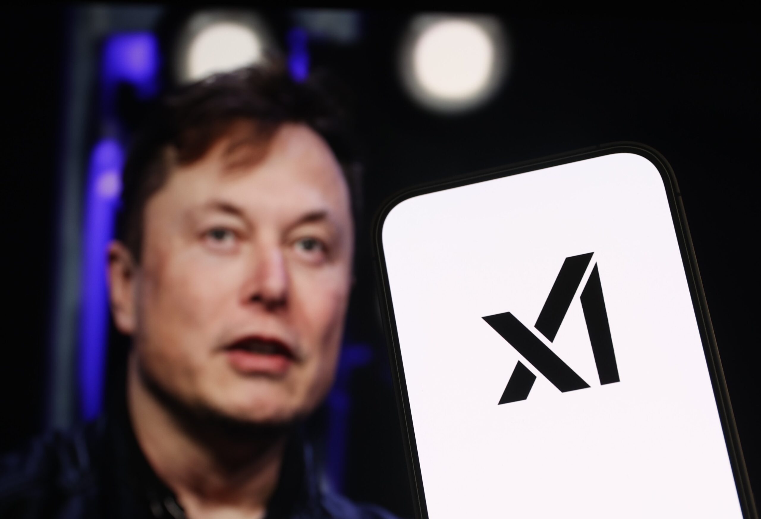 Elon Musk and xAI logo