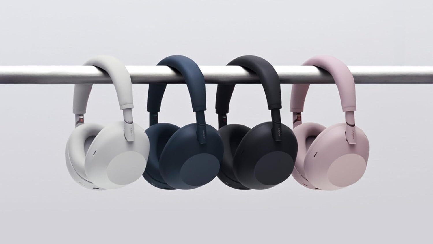 the Sony XM-6 headphones in a row hanging on a bar