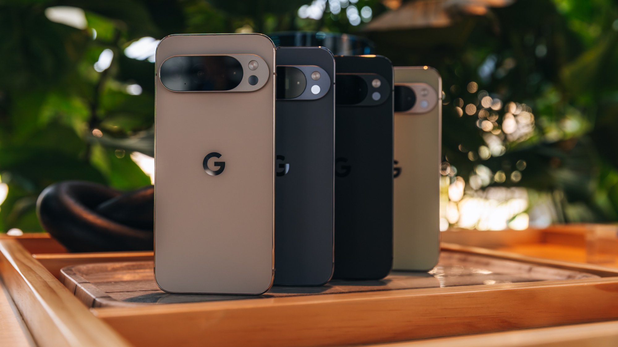 Four Google Pixel 10 Pro phones lined up in a row