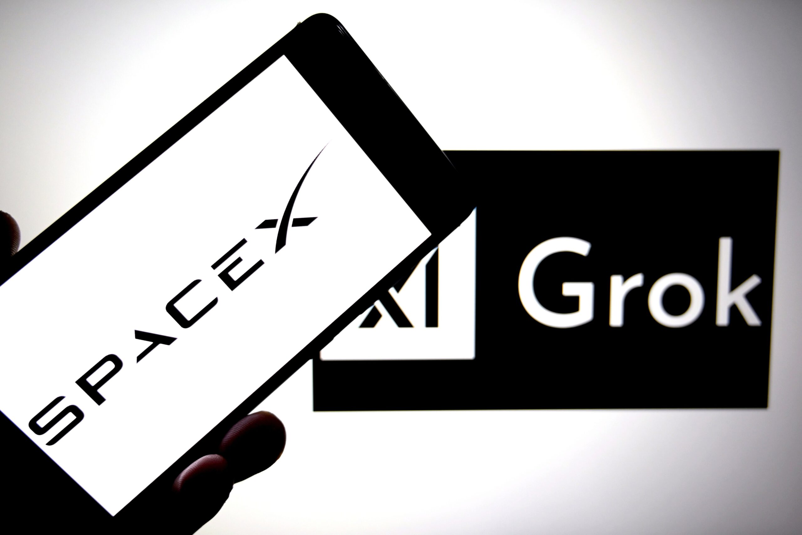 SpaceX, xAI, and Grok logos