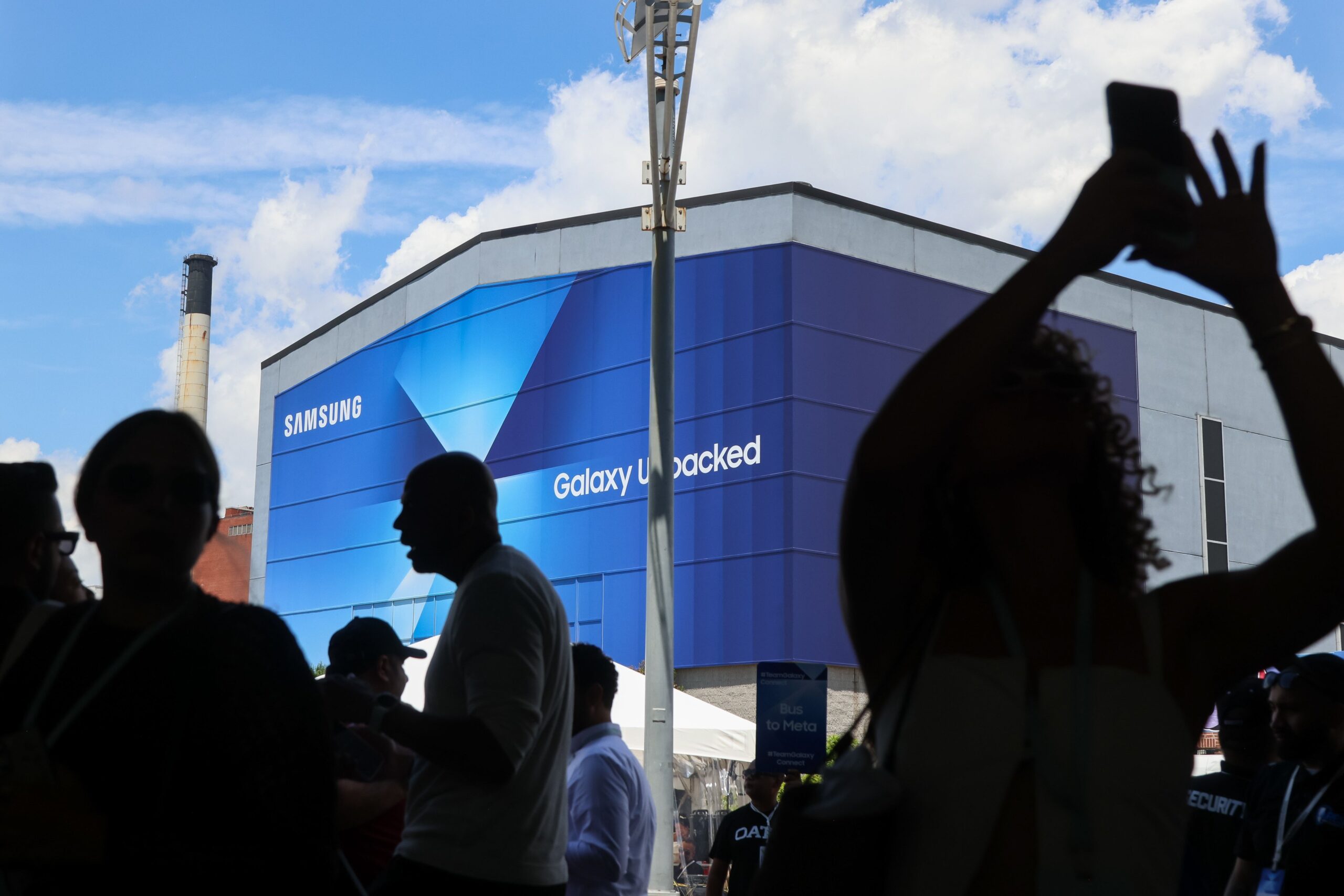 An attendee takes a photo during Galaxy Unpacked at the Brooklyn Navy Yard