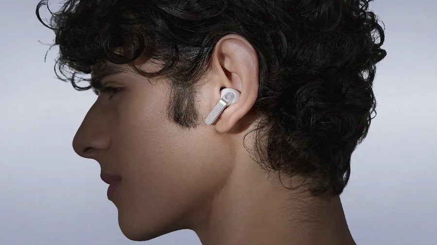 man wearing white samsung galaxy bud4 earbuds
