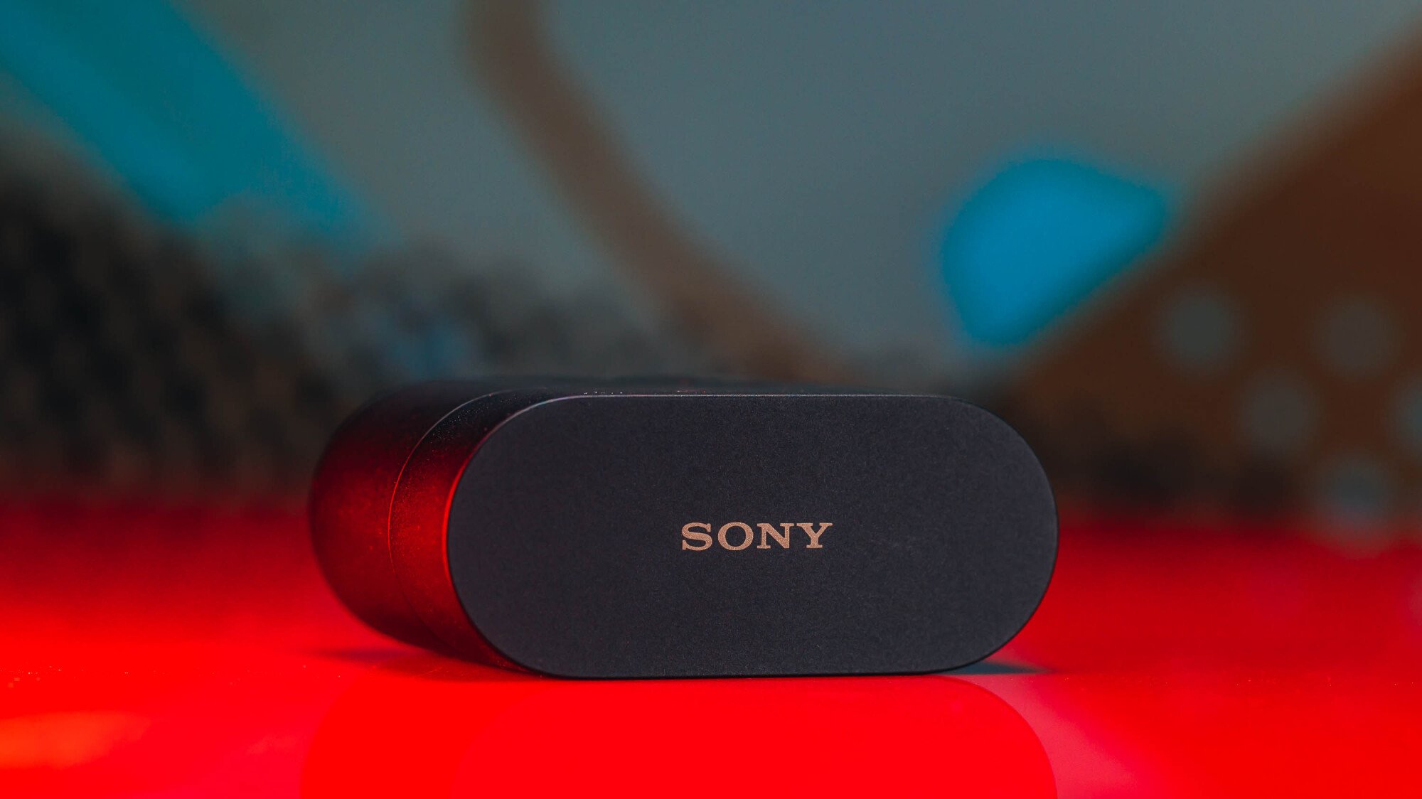 sony case laying flat against red and bluish background