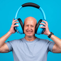 a man wearing the JLab Blue XL Speaker Headphones