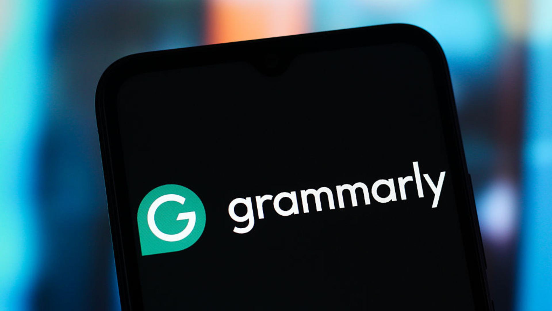 The Grammarly logo is seen displayed on a smartphone screen.