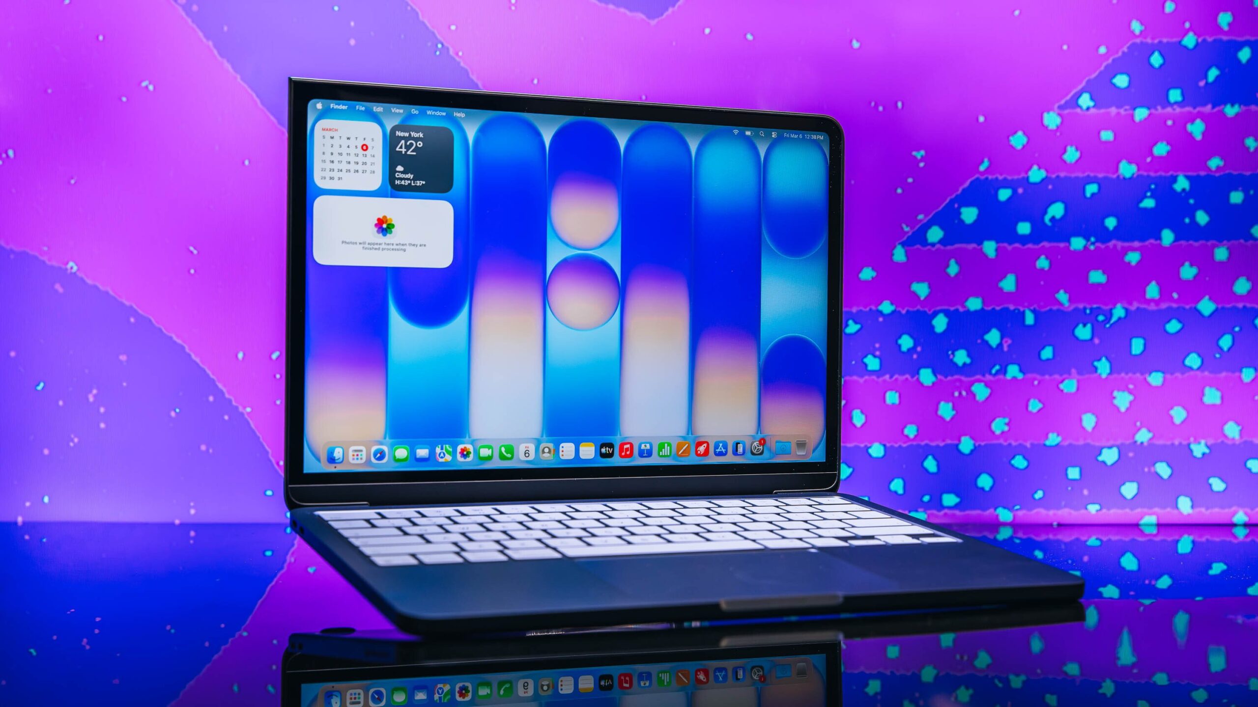 macbook neo in indigo open to home screen