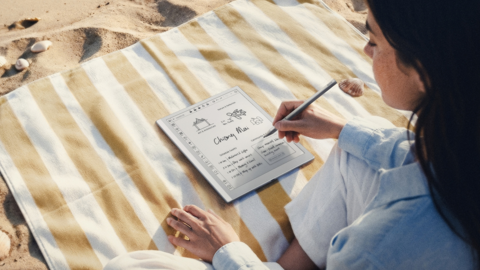 A person writing with the Boox Go 10.3 Gen II